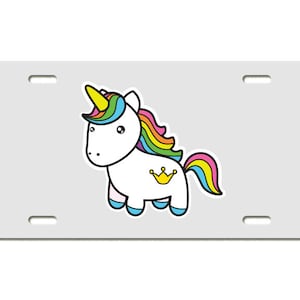 May include: A white unicorn with a rainbow mane and tail. The unicorn has a gold crown on its side. The unicorn is on a gray background.