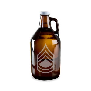 May include: A brown glass growler with a silver lid and a white military rank insignia on the front.