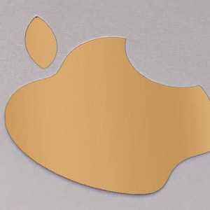May include: A gold-colored Apple logo with a leaf on top. The logo is on a light gray background.
