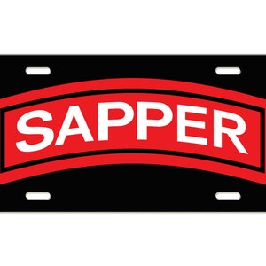 May include: Black license plate with a red and white "SAPPER" patch.