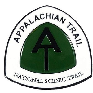May include: White triangular patch with a black outline and the text "Appalachian Trail National Scenic Trail". Inside the triangle is a green circle with a black "A" inside.