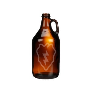 May include: A brown glass growler with a handle. The growler has a white etched design of a lightning bolt inside a shield shape.