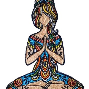 May include: Embroidered patch of a woman in a colorful yoga pose with her hands in prayer position. The patch is detailed with intricate patterns and designs.