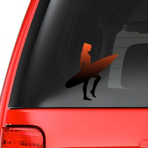 May include: A silhouette of a person surfing on a surfboard. The person is facing to the right and the surfboard is orange. The image is a decal sticker.
