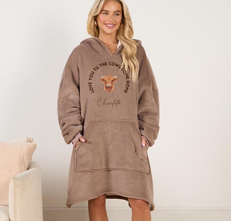 May include: A brown oversized hoodie with a cow graphic and the text "Love you til the cows come home" and the name "Charlotte".