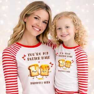 May include: Matching white and red striped shirts with the text "You're My Butter Half" and "I'm Your Butter Half". Each shirt features a cartoon illustration of two pieces of toast with butter and the names "Mummy & Lola".