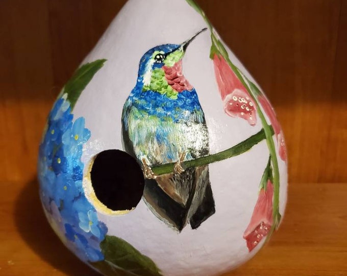 Featured listing image: Gourd birdhouse with our hand painted hummingbird feeding on fox gloves and hydrangeas.