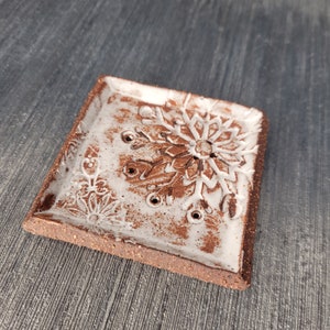 Small square soap dish.