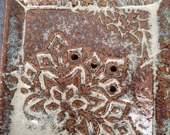 Small square soap dish.