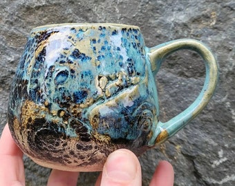 Handmade rustic drinking cup. Each with its own unique texture markings and glaze. hand made here in Ireland
