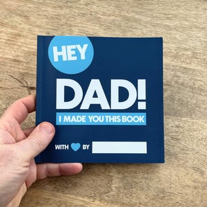May include: A blue book with the text "Hey Dad! I made you this book" and a blank space to fill in "with love by".
