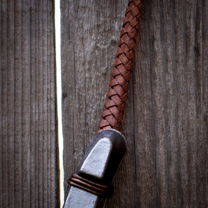 Close up pic of lucky horseshoe leather hanger detail.