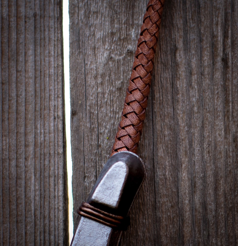 Close up pic of lucky horseshoe leather hanger detail.