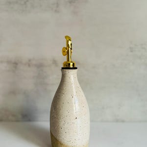 Handmade Ceramic Olive Oil Bottle: Speckled White Pottery Cruet with Gold Pourer