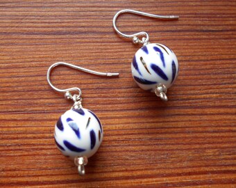 Pretty porcelain sphere earrings, blue underglaze and copper lustre strokes, smart