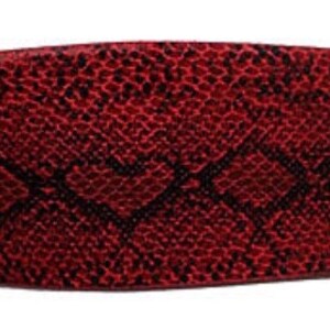 May include: A wide red belt with a snakeskin pattern.