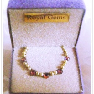 Boxed crystal & gold bead miniature necklace.