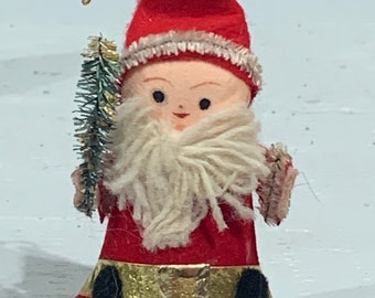 Santa, made in Japan in 1960s, spun cotton head, felt clothes, bottle brush tree, cone body.