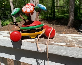 Vintage Kouvalias Wooden Pull Toy,  Greek 1970s Bell, Flower Primary Colors on Springs Jiggle, rusty crusty, vintage pull toy, toddlers toy