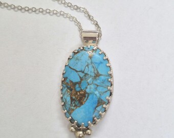 Turquoise  Pendant, Sterling Silver Bezel . Turquoise with copper inclusions. Lovely colour.