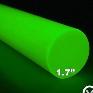 May include: A vivid neon green cylindrical rod, 4.3 cm in diameter, is displayed against a dark backdrop. The smooth, solid material is illuminated, showcasing its bright colour and form. The Carbonwaves logo is in the bottom right corner.