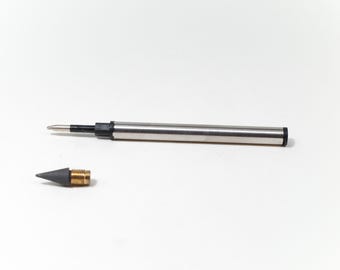 May include: A silver pen with a black tip and a separate black and brass tip.