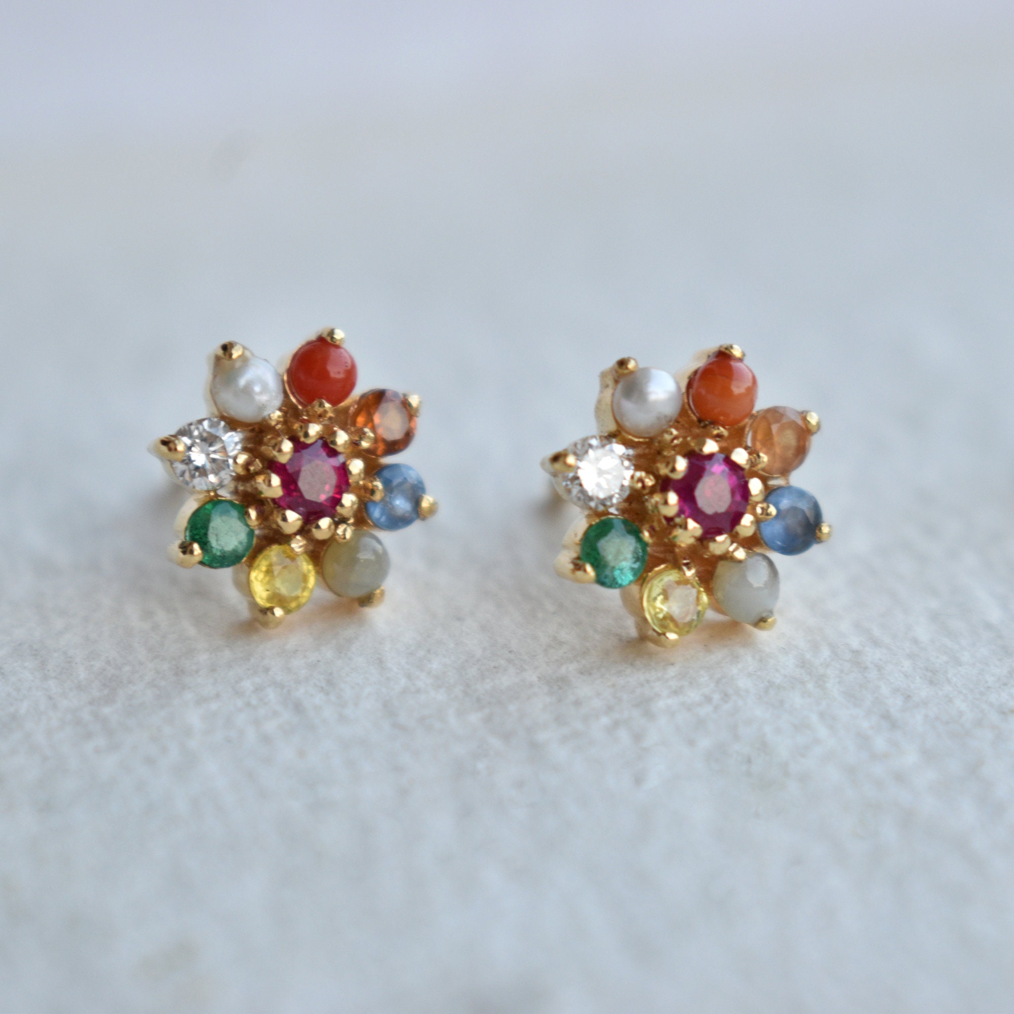 Gold Finish Navratna Stone Stud Earrings Design by Anjali Jain Jewellery at  Pernia's Pop Up Shop 2024