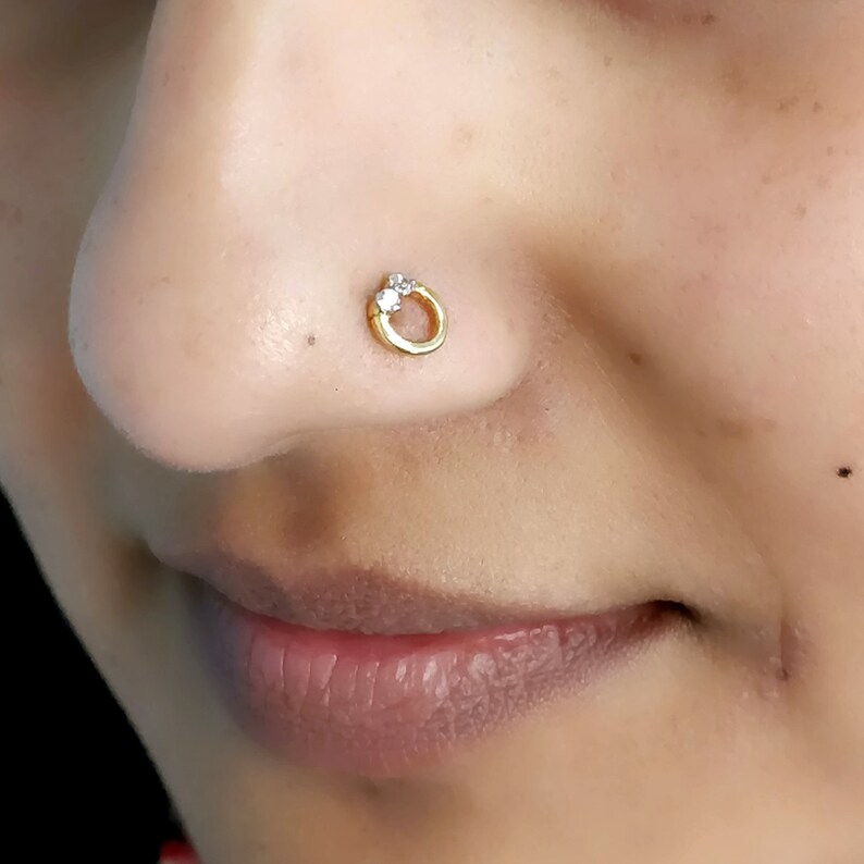 nose piercing with gold wire