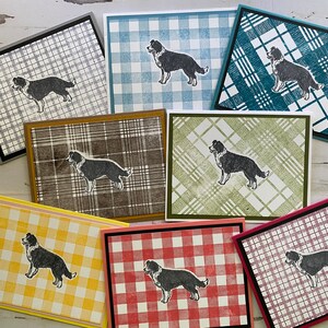 May include: Nine cards with different plaid patterns, each featuring a black and white border collie dog silhouette.