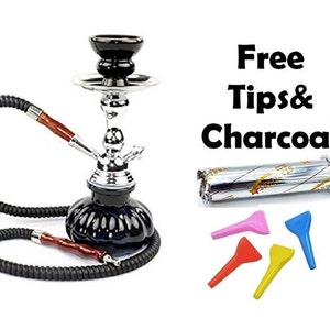 May include: A black and silver hookah with a glass base and a black bowl. It comes with a hose, a bowl, and a set of colorful silicone tips. The text "Free Tips & Charcoal" is visible in the image.