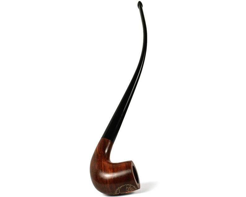 May include: A brown wooden pipe with a black stem. The pipe has a curved bowl and a long, thin stem.