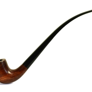 May include: A long, curved wooden pipe with a black stem. The bowl of the pipe is decorated with a carved design.