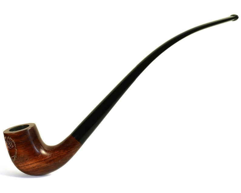 May include: A long, curved wooden pipe with a black stem. The bowl of the pipe is decorated with a carved design.