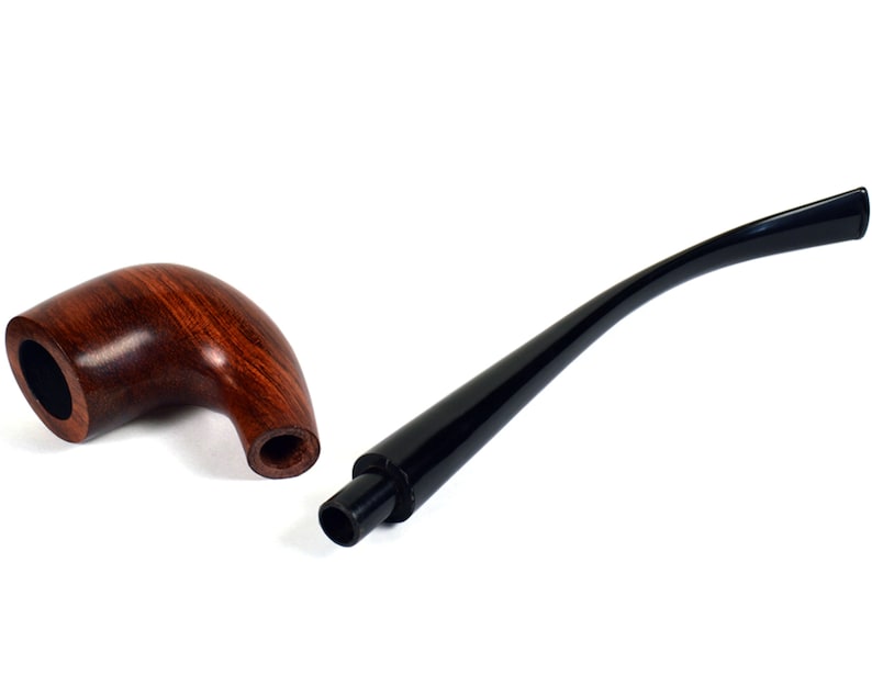 May include: A wooden pipe with a brown finish and a black stem. The pipe is disassembled, showing the bowl and the stem separately.