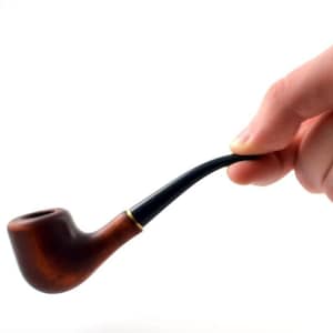 Puede incluir: Una pipa de madera marrón con una boquilla negra. La pipa se sostiene en una mano.