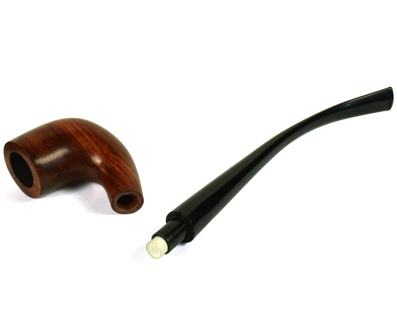 May include: A brown wooden pipe with a black stem and a white mouthpiece. The pipe is disassembled, showing the bowl and stem separately.