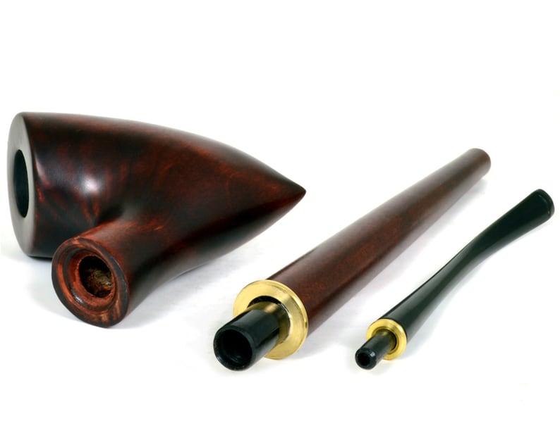 May include: A dark brown wooden smoking pipe with a long, thin stem and a bowl shaped like a pointed teardrop. The pipe is disassembled into three pieces: the bowl, the stem, and the mouthpiece.