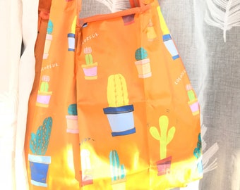 Orange and multicolor cactus print reusable, eco bag.