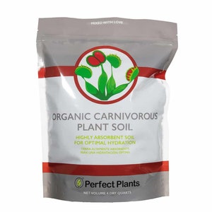 May include: A white bag with red and green accents, labeled "Organic Carnivorous Plant Soil". The bag contains a soil mix for carnivorous plants and is labeled "Highly absorbent soil for optimal hydration". The bag is labeled "Perfect Plants" and has a net volume of 4 dry quarts.