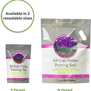 May include: Two bags of African Violet Potting Soil, one 2 quart bag and one 8 quart bag. Both bags feature a purple African Violet plant with green leaves and a pink and white label with the text "African Violet Potting Soil" and "Perfect Plants."