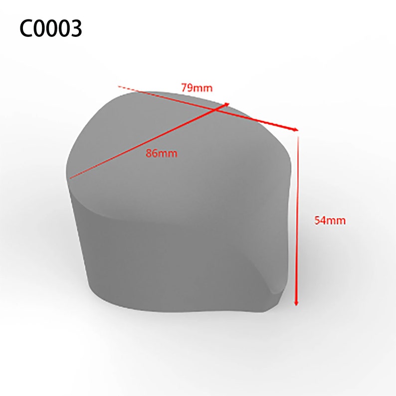May include: A gray, irregularly shaped object with rounded edges. The object is 79mm wide, 86mm long, and 54mm high.