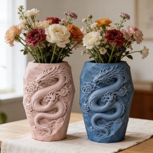 May include: Two decorative vases, one pink and one blue, each featuring a detailed dragon design. The vases are filled with colorful flowers, including roses and carnations. The vases are on a wooden table.
