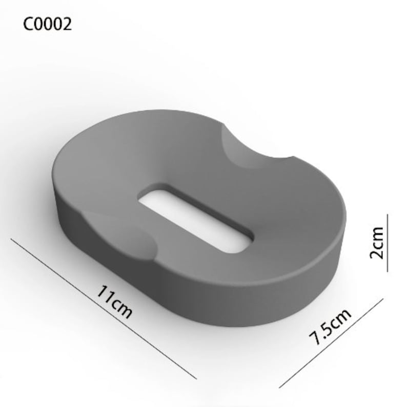 May include: Gray, oval-shaped cushion with a rectangular cutout in the center. The cushion measures 11 inches long, 7.5 inches wide, and 2 inches high.