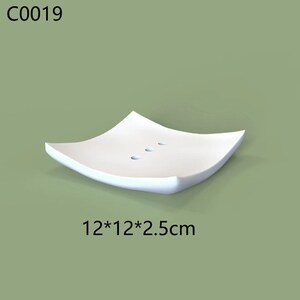 May include: White ceramic soap dish with three drainage holes. The dish is 12 inches by 12 inches and 2.5 inches tall.
