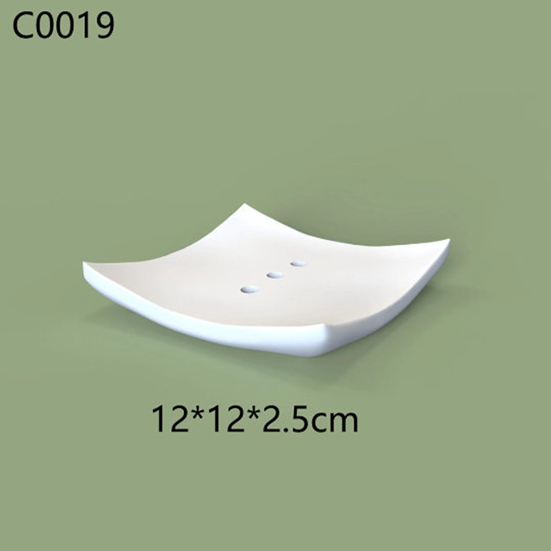 May include: White ceramic soap dish with three drainage holes. The dish is 12 inches by 12 inches and 2.5 inches tall.