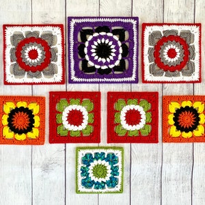 May include: Nine colorful crocheted squares with different geometric patterns. Each square features a central circle with a unique design. The squares are arranged in a triangular shape on a white wooden background.