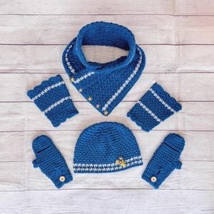 May include: A matching set of knitted winter accessories in a vibrant blue. The set includes a hat, scarf, two fingerless gloves, and two mittens. Each piece is adorned with white stripes and small gold star accents, creating a cohesive and stylish look.