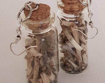 Pair of poison bottles with rabbit teeth and bones earrings