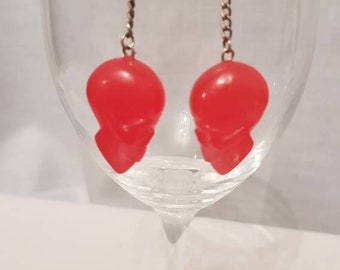 Red resin skulls chained earrings