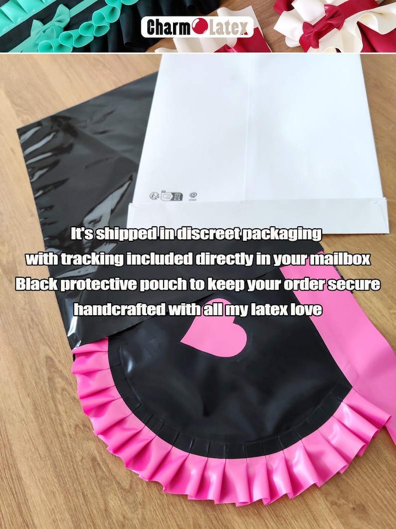 May include: Black latex apron with a pink ruffled trim and a heart-shaped detail. The apron is paired with a pink sash. The image also shows a black protective pouch and a white envelope.